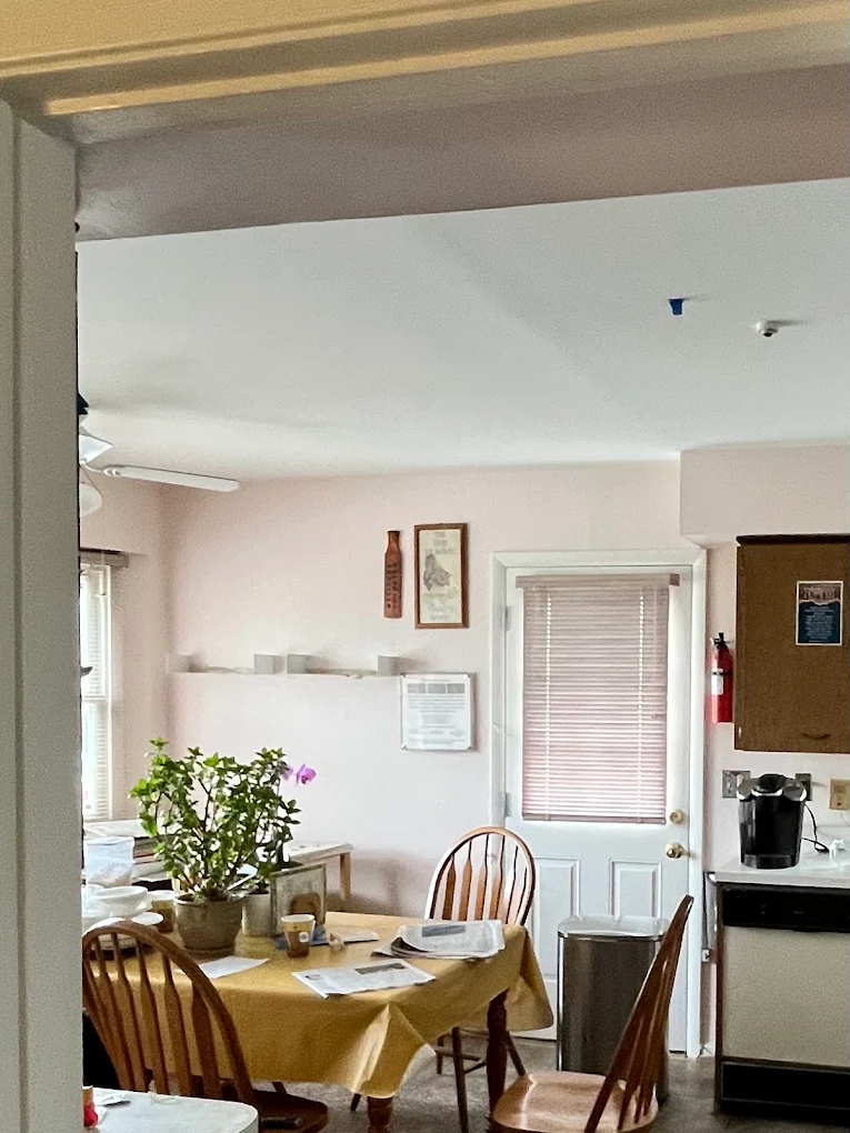 Kitchen and dining area painted soft blush with white ceiling and trim